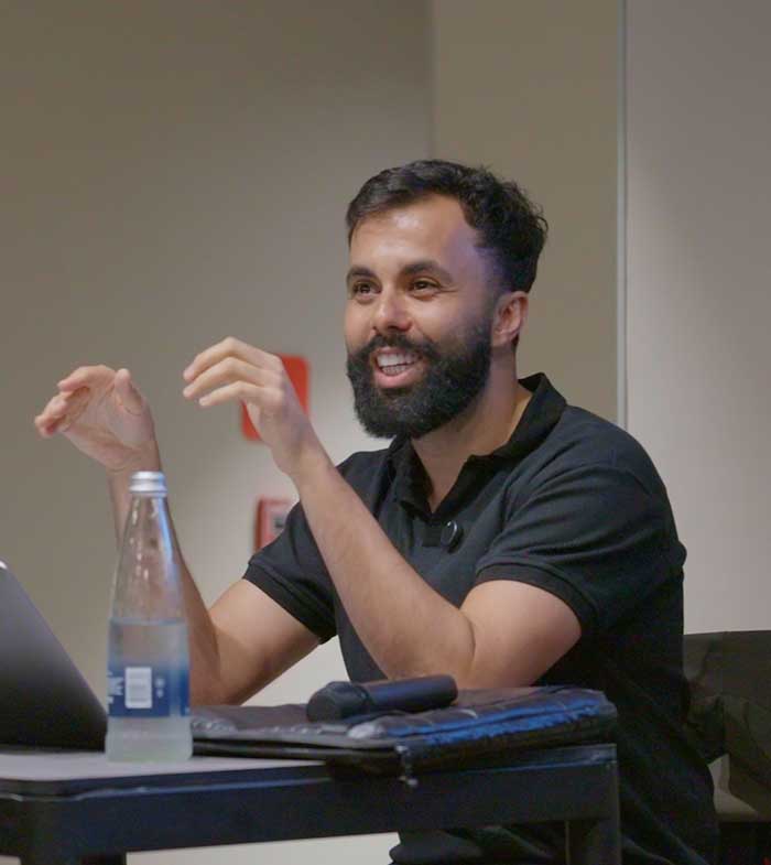 Alfred speaking at a tech event